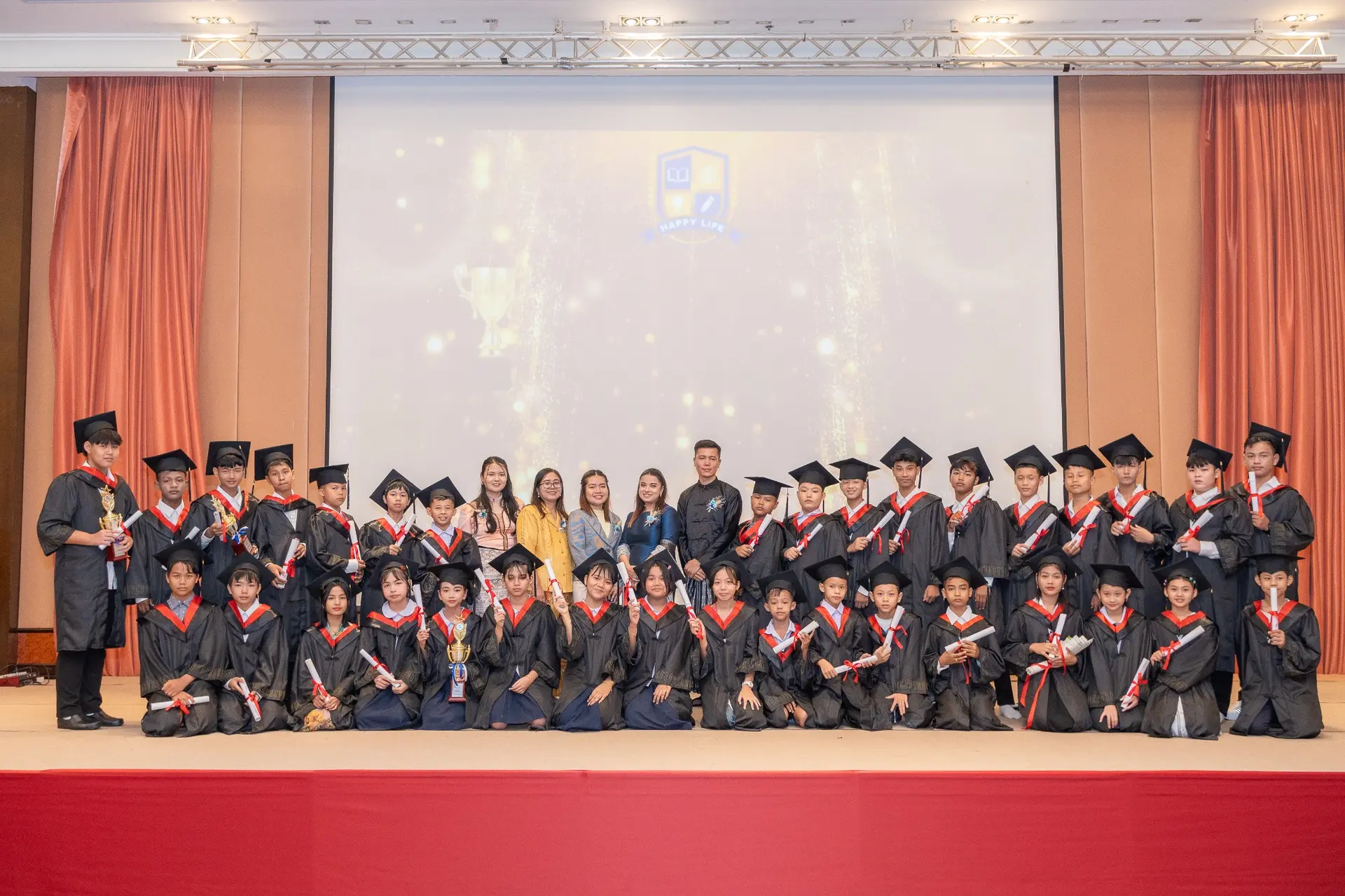 Kong Lah School graduates celebrating together with their teachers.