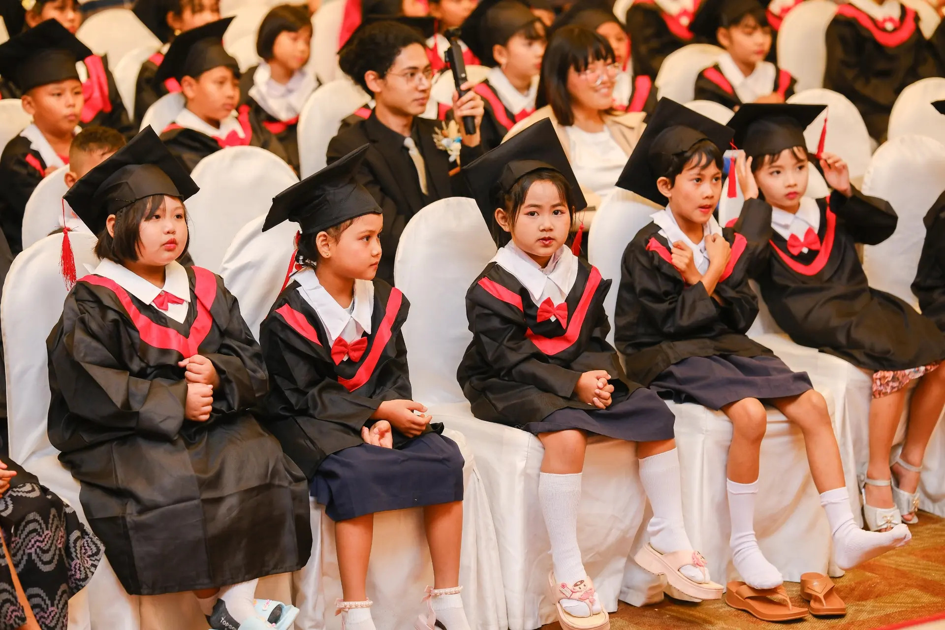 Young Kong Lah School graduates seated together during their ceremony.