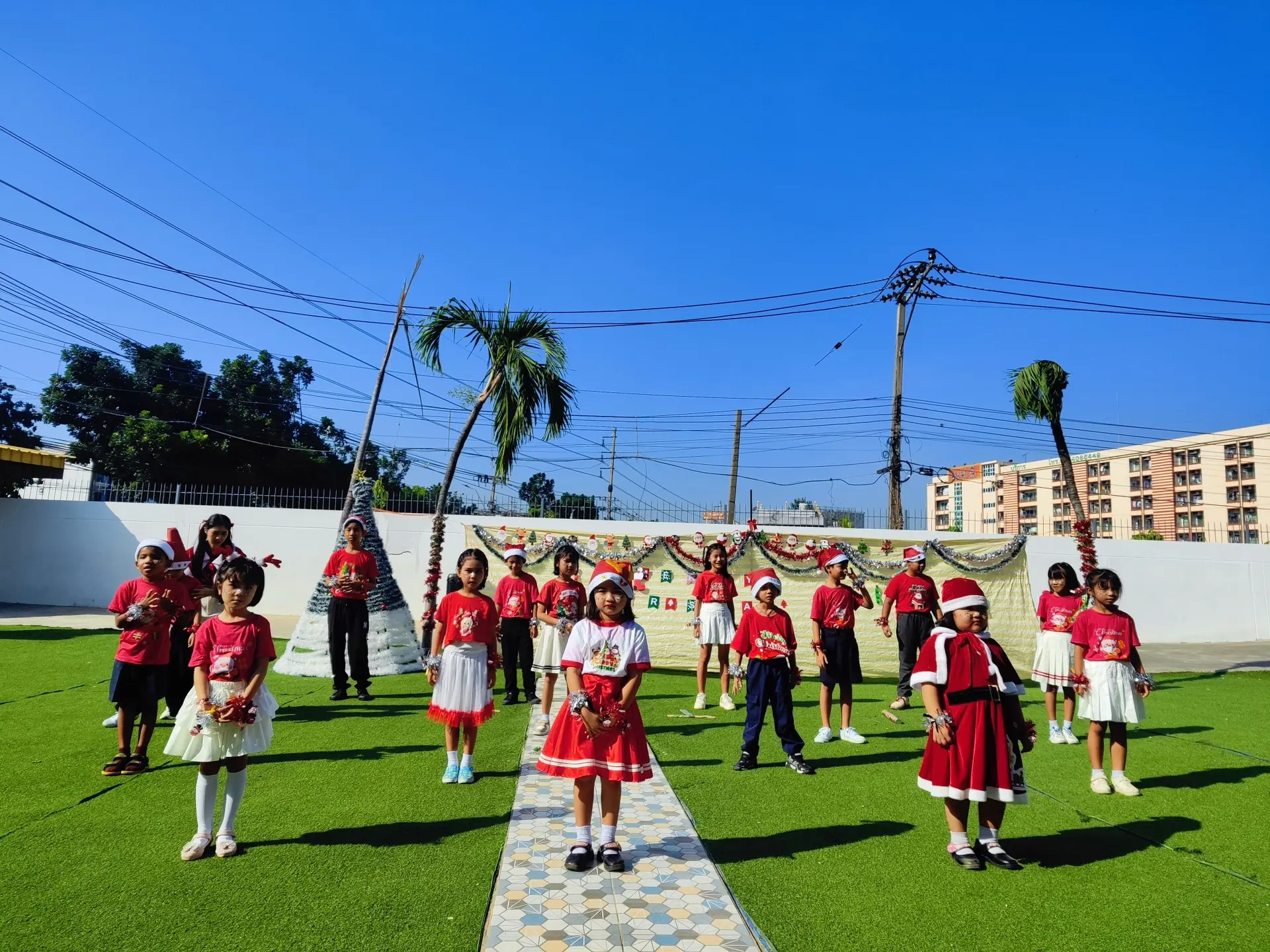 Kong Lah School students performing outdoors on campus.